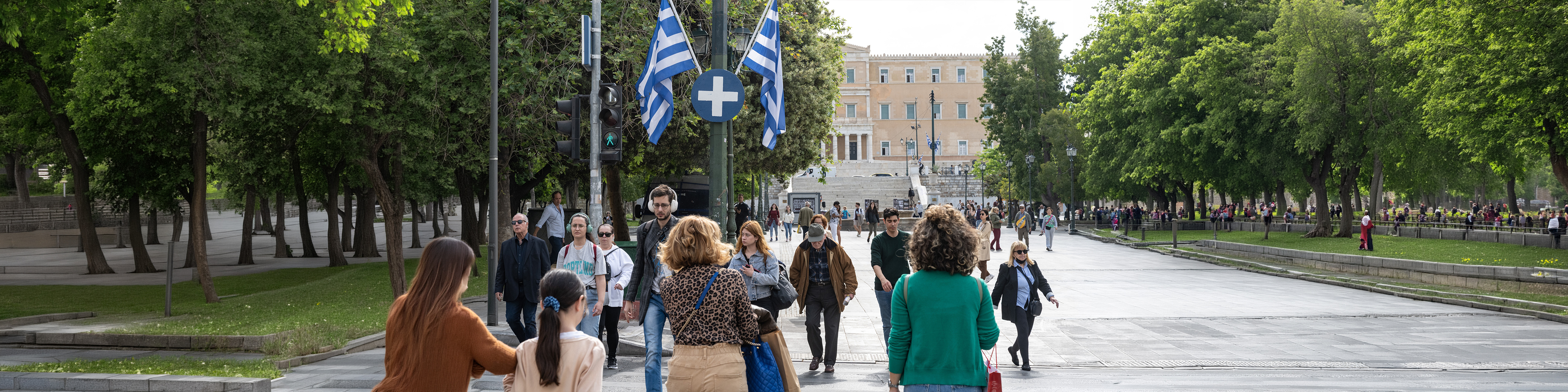 People walking in the Syntagma square in Athens, Greece. View of Syntagma square in Athens with crowd