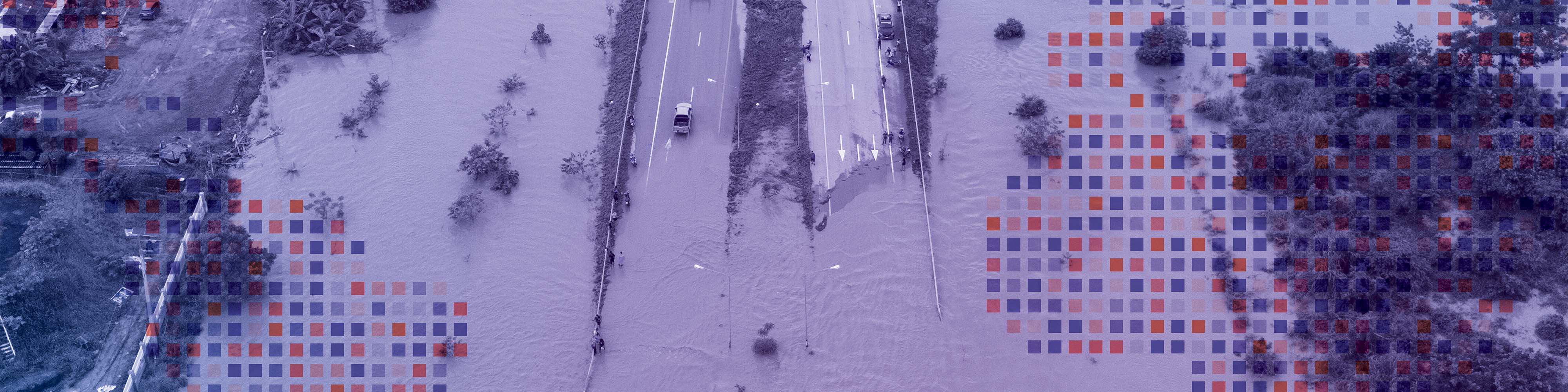 Two way highway floded by the river.