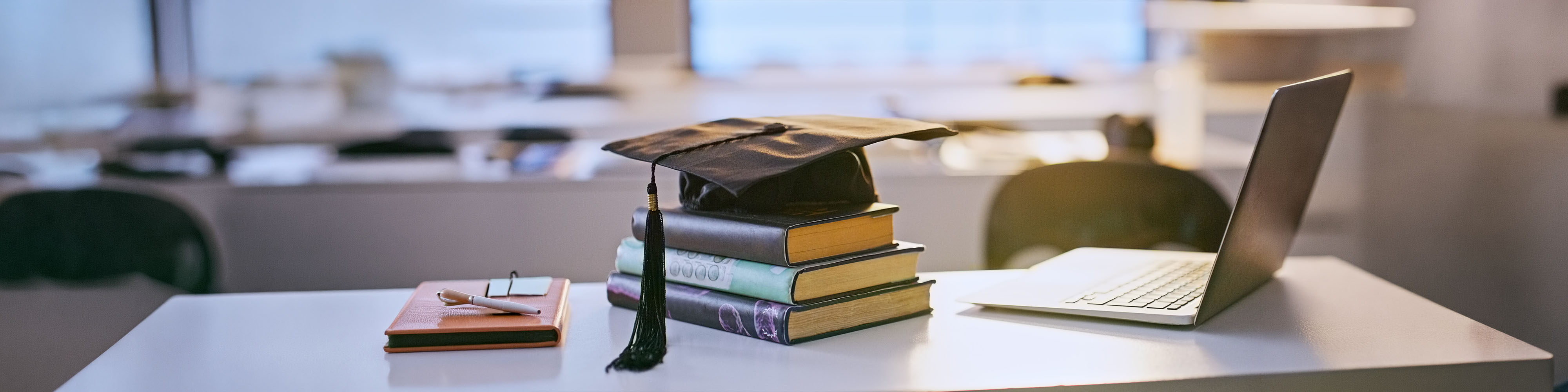 Graduation cap, books and laptop or university education for future goal, scholarship or online. Studying, research and thesis proposal for final school project for learning course, report or student.