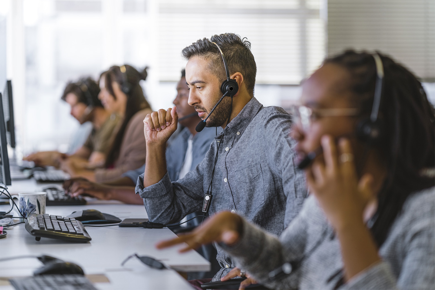 Executive listening to customer query on headset